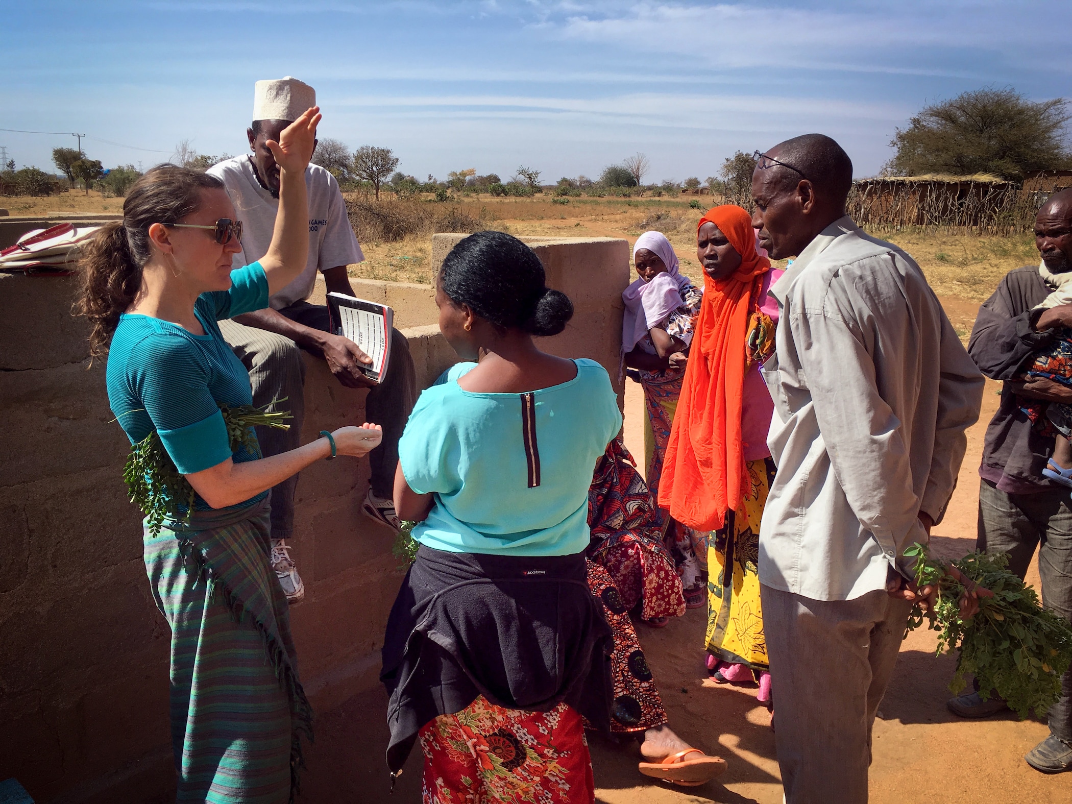 Carrie Waterman talking with local communities in Singida, Tanzania that are part of an ongoing 5-year participatory project on agroecology, climate change, nutrition and social equity. They discussed the nutritional and health benefits of moringa. (Photo Courtesy of Carrie Waterman)