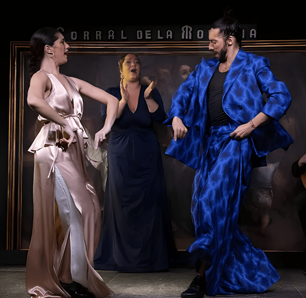 Flamenco dancers perform at a traditional tablao flamenco venue.