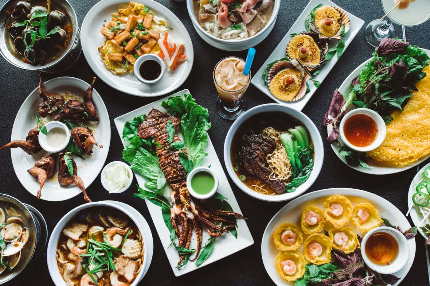 multiple dishes filled with food on a table