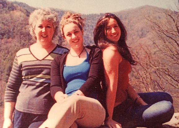 A teenage Alysse with her mom and sister on a family vacation.