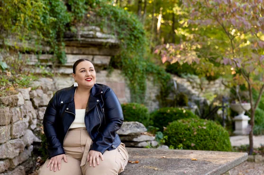 Alysse sits enjoying the manicured gardens outside Grotto Spring.