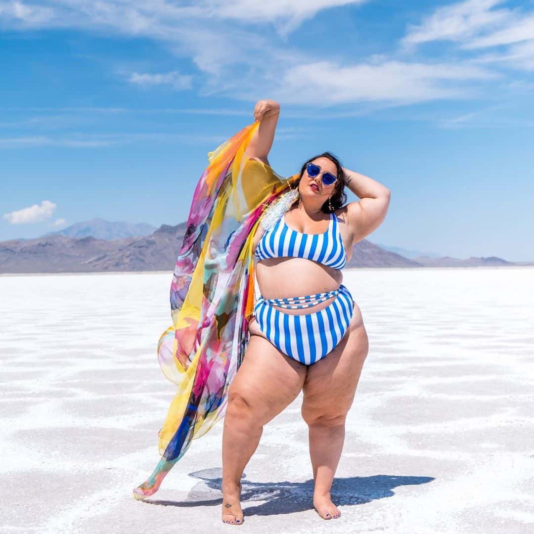 Alysse poses in a blue and white striped bikini on Utah’s stark Bonneville salt flats.