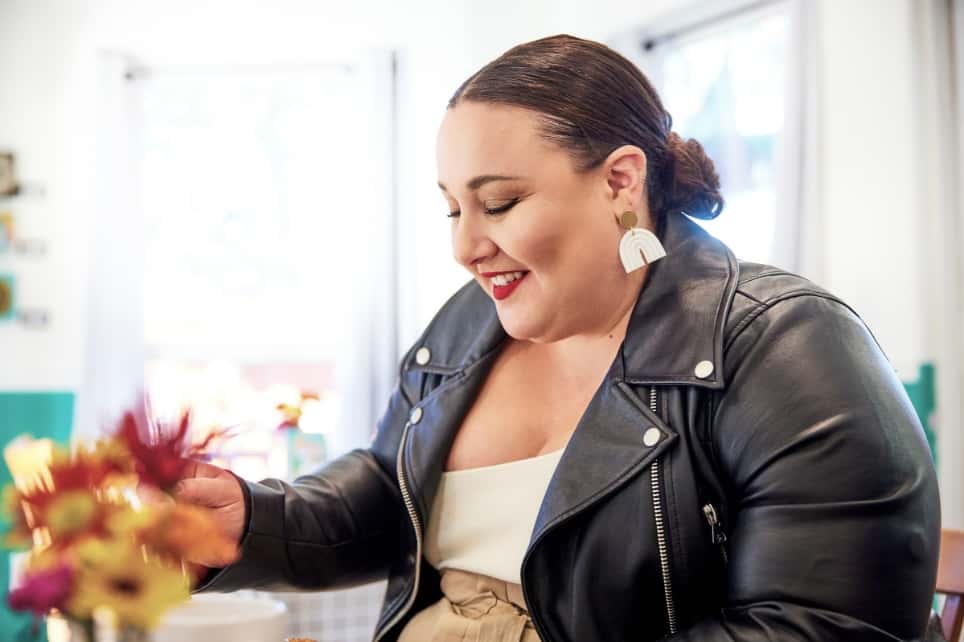 Alysse in the bright and airy interior of Three Bird Café.