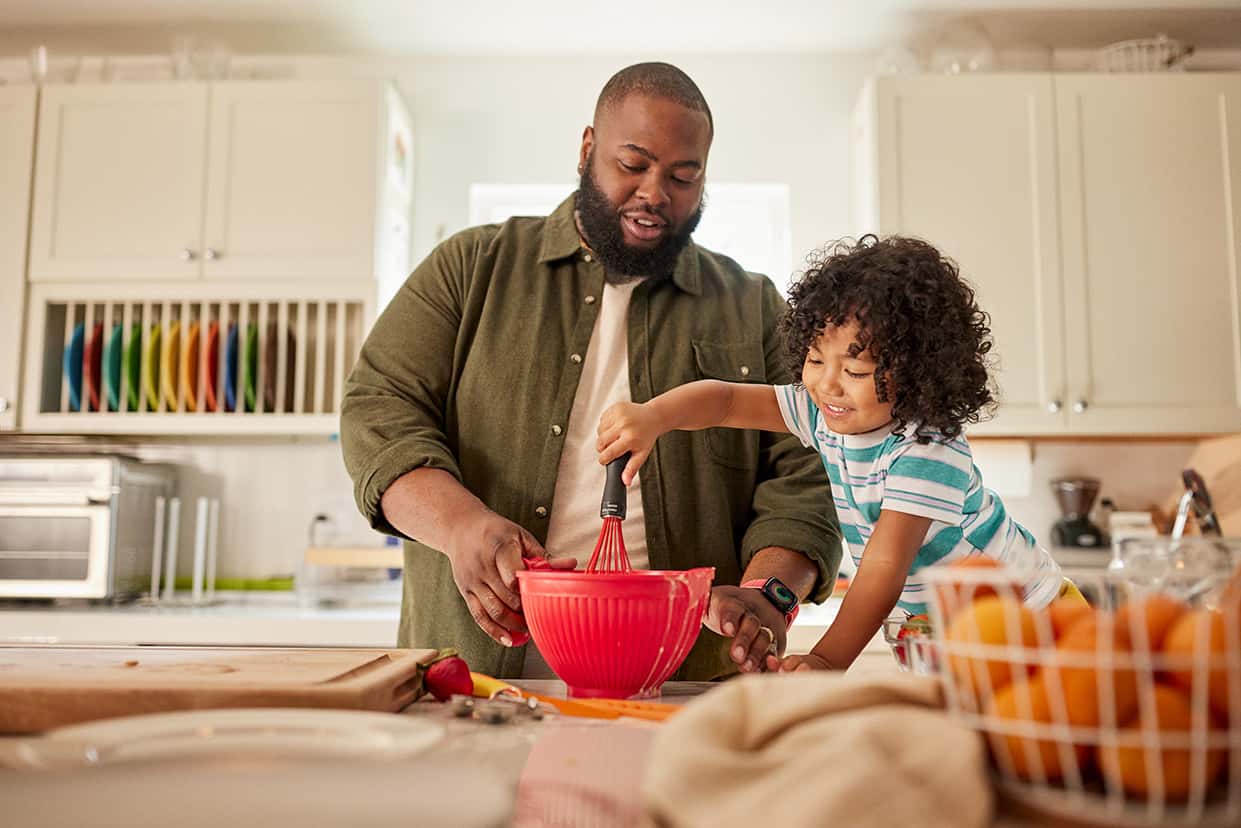 Man and daughter making healthy food
