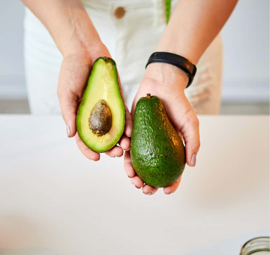Avocado in hands