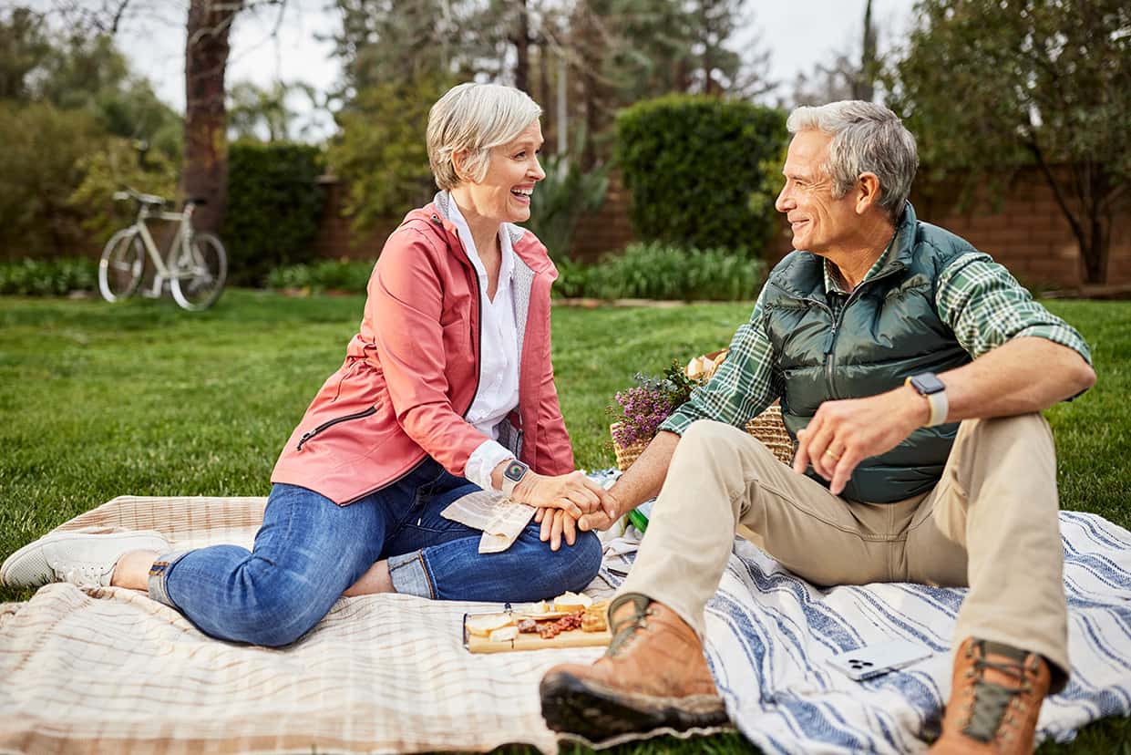 Couple eating healthy picnic outside
