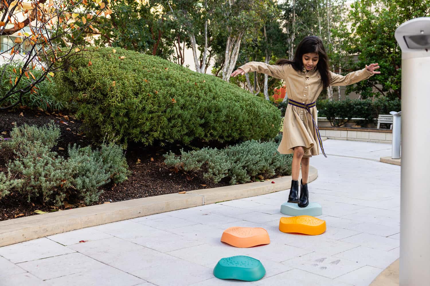 Leen stepping on colorful rocks