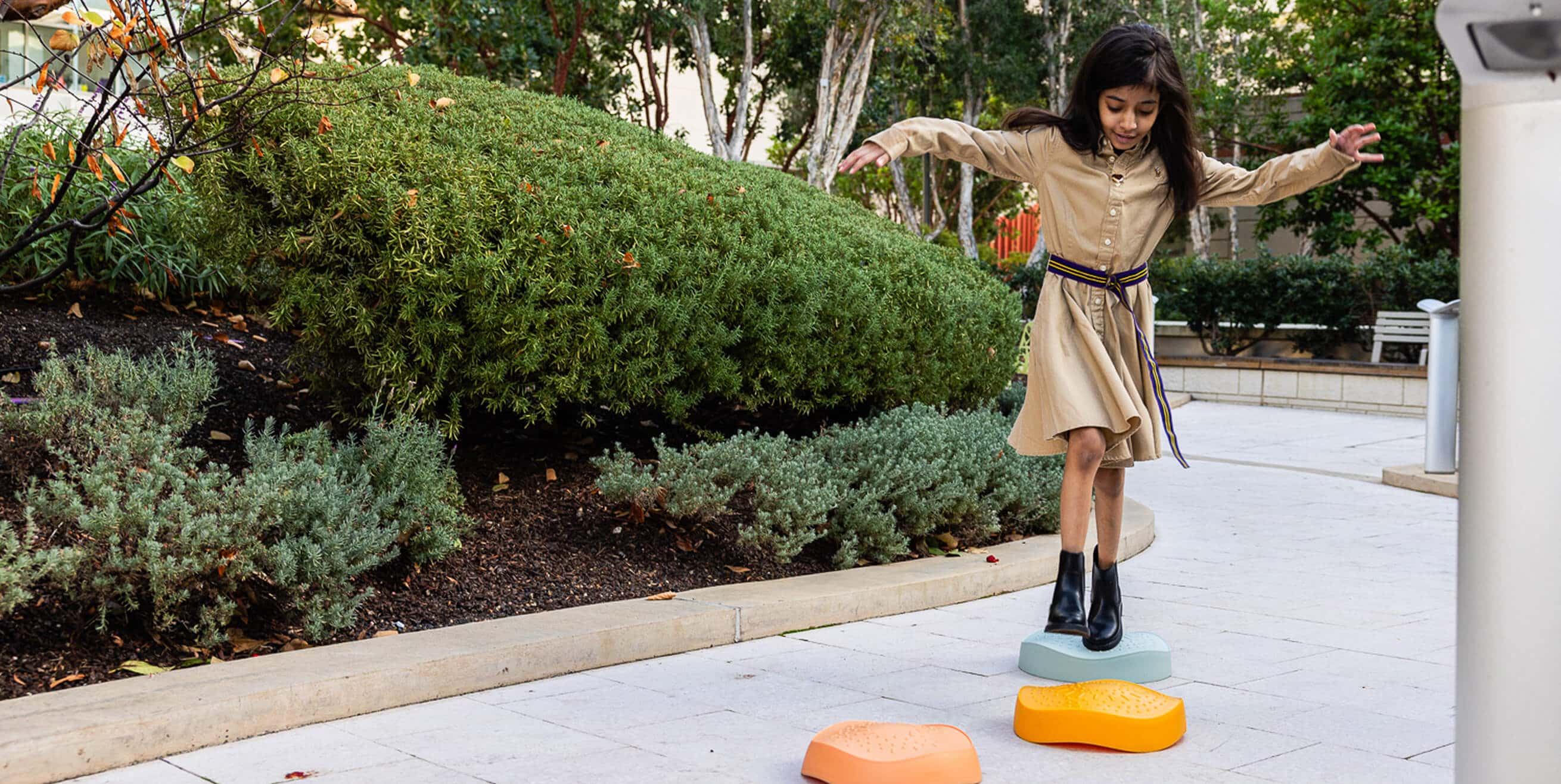 Leen stepping on colorful rocks