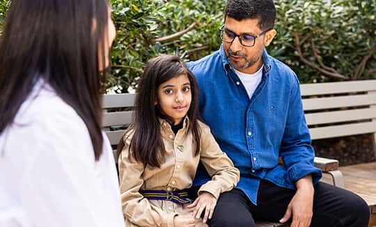 Leen and father Mohammed on bench