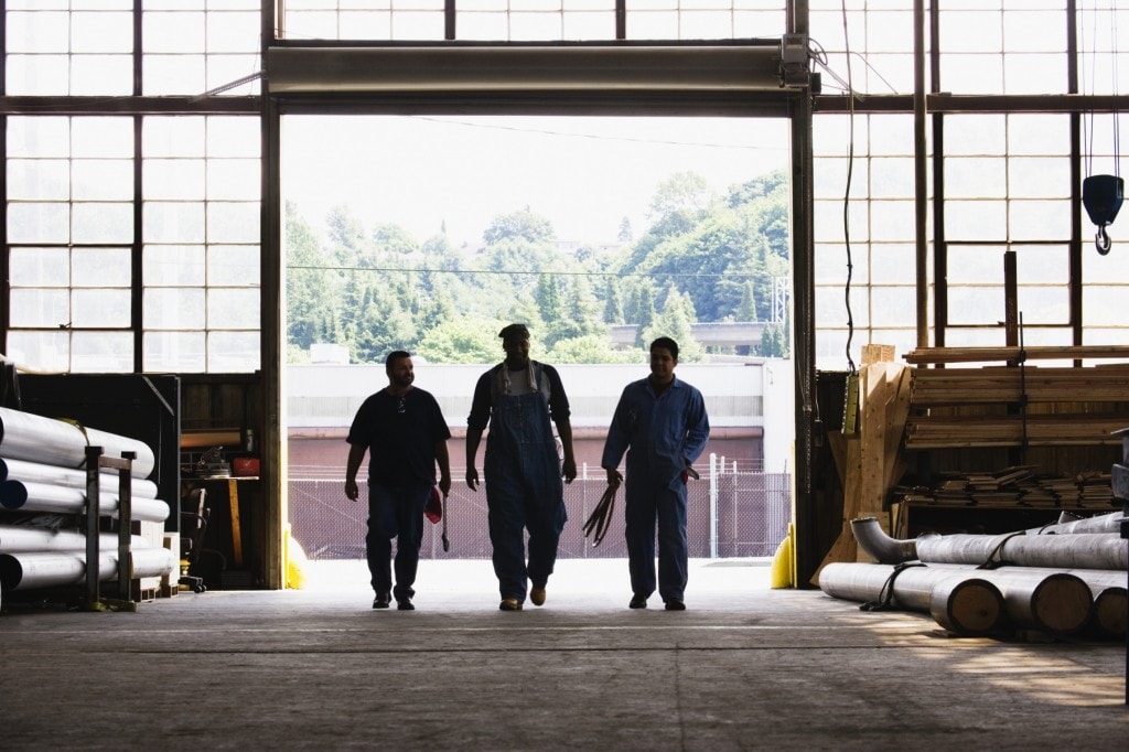Three Workers Entering Factory