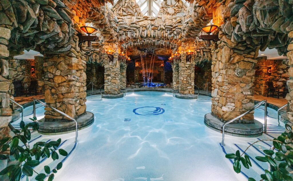 A large indoor pool in a stone building.