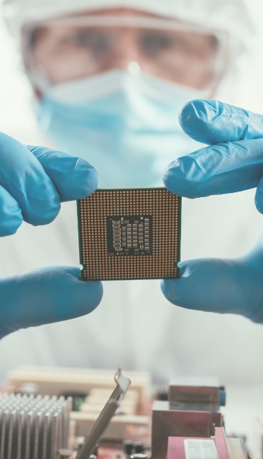 A man is holding a cpu in his hands.