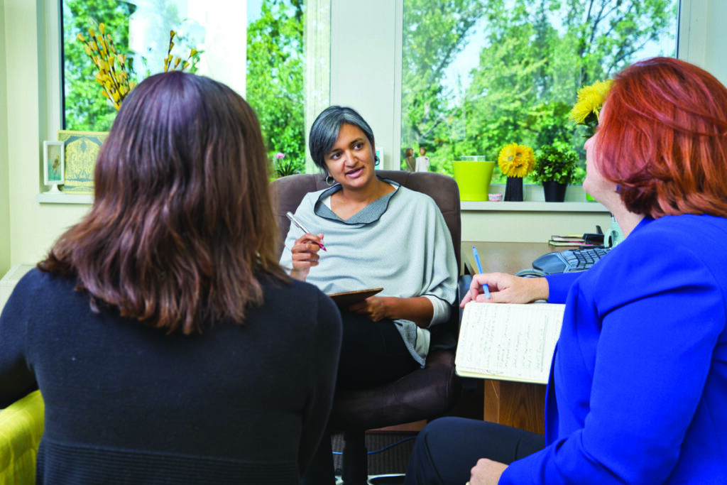 A woman sitting in a chair.