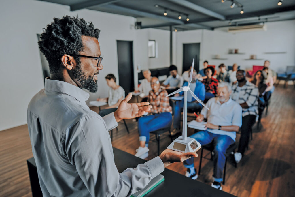 A man giving a presentation to a group of people.